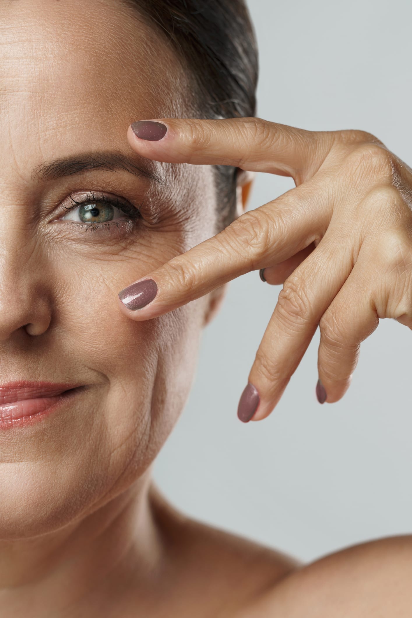 Beautiful middle aged woman with clean wrinkled skin